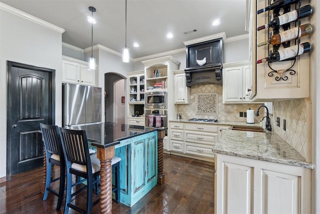 2528 E Bradley St, Shawnee, OK 74804 - kitchen featuring stainless steel appliances, ornamental molding, dark wood-style flooring, light stone countertops, and recessed lighting