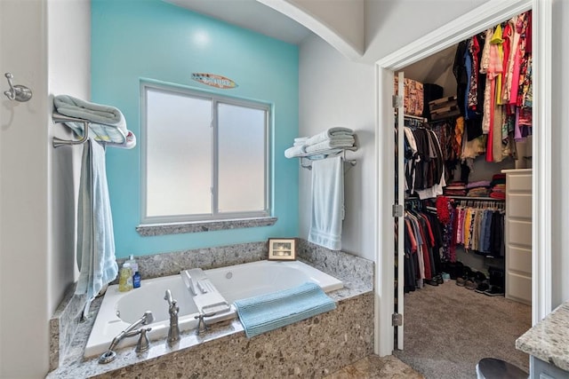 2528 E Bradley St, Shawnee, OK 74804 - bathroom featuring a bath and a walk in closet