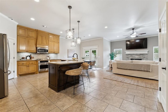 4932 Mahogany Dr, Edmond, OK 73025 - kitchen featuring stainless steel appliances, a sink, recessed lighting, backsplash, and ceiling fan