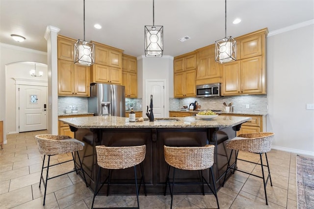 4932 Mahogany Dr, Edmond, OK 73025 - kitchen featuring appliances with stainless steel finishes, a sink, baseboards, backsplash, and light tile patterned floors