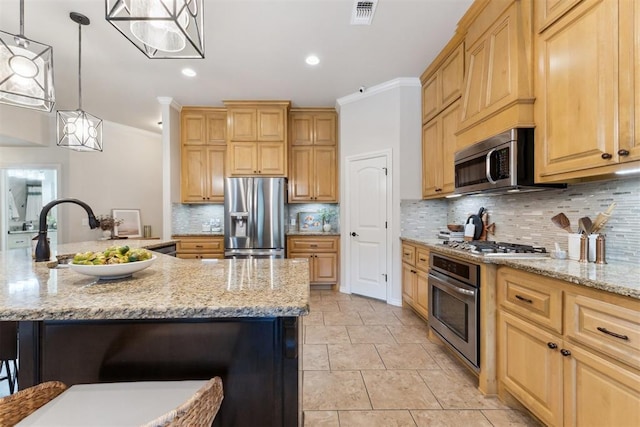 4932 Mahogany Dr, Edmond, OK 73025 - kitchen featuring appliances with stainless steel finishes, decorative backsplash, light stone countertops, crown molding, and hanging light fixtures