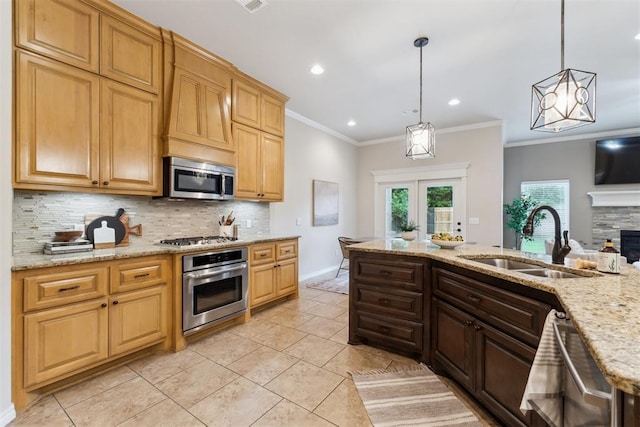 4932 Mahogany Dr, Edmond, OK 73025 - kitchen with stainless steel appliances, a sink, backsplash, light tile patterned flooring, and pendant lighting