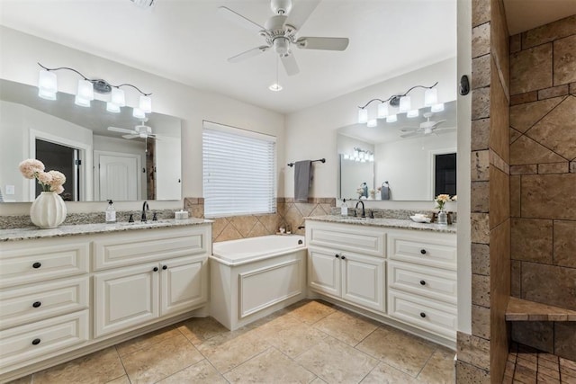 4932 Mahogany Dr, Edmond, OK 73025 - full bath featuring ceiling fan, two vanities, a bath, and tile patterned flooring
