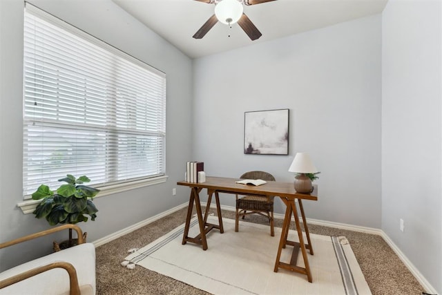 4932 Mahogany Dr, Edmond, OK 73025 - home office with light colored carpet, ceiling fan, and baseboards