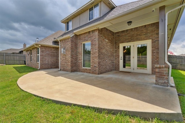 4932 Mahogany Dr, Edmond, OK 73025 - rear view of house featuring french doors, a patio area, brick siding, and a shingled roof