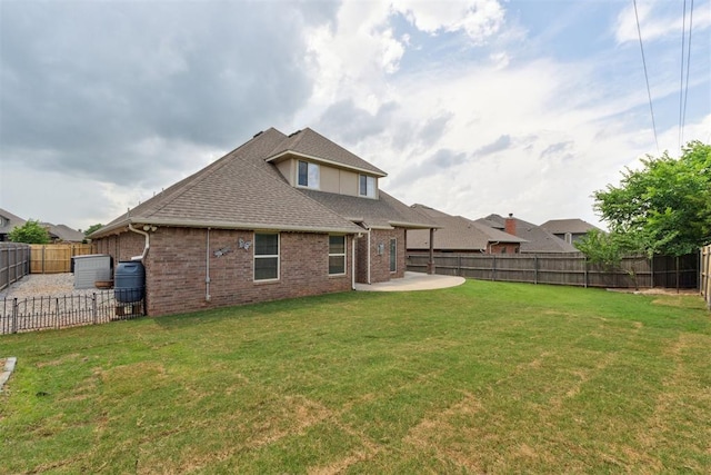 4932 Mahogany Dr, Edmond, OK 73025 - rear view of property with a patio, roof with shingles, and brick siding