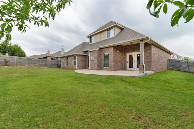 4932 Mahogany Dr, Edmond, OK 73025 - rear view of property with french doors, a patio, brick siding, and a shingled roof