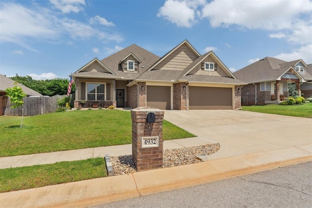 4932 Mahogany Dr, Edmond, OK 73025 - craftsman-style home featuring an attached garage, concrete driveway, brick siding, and a shingled roof