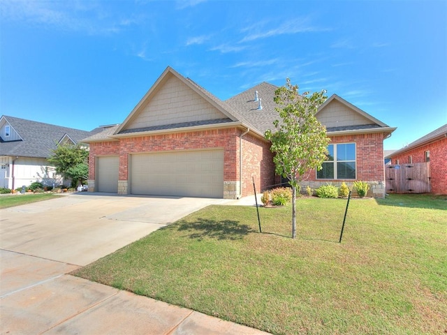 404 Braxton Way, Yukon, OK 73099 - view of front of home with a garage, concrete driveway, roof with shingles, and brick siding