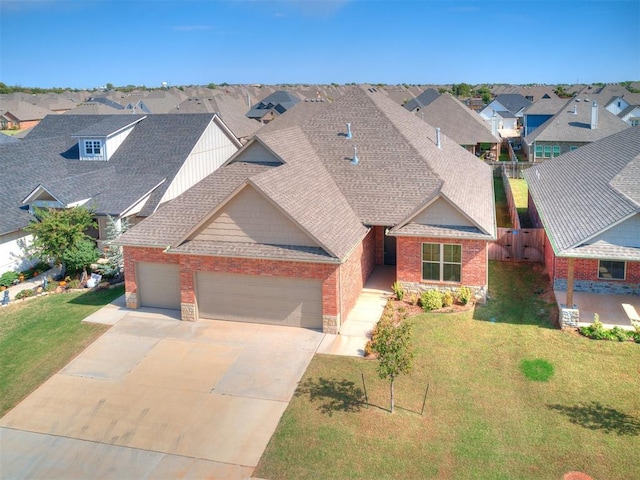 404 Braxton Way, Yukon, OK 73099 - view of front of home featuring an attached garage, roof with shingles, a residential view, and brick siding