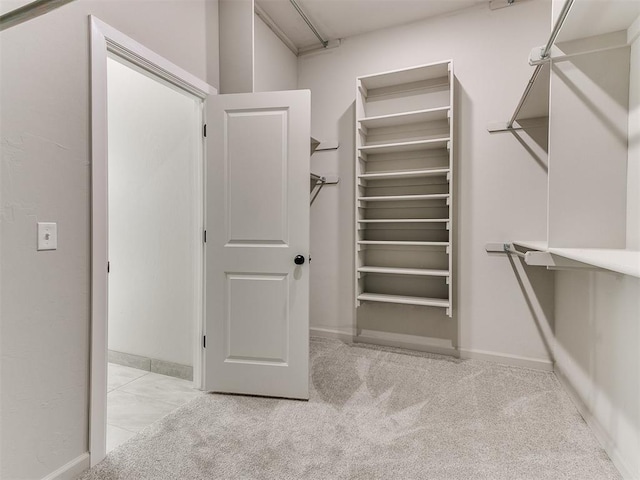 404 Braxton Way, Yukon, OK 73099 - spacious closet featuring carpet floors
