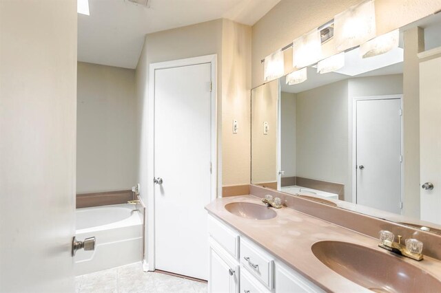 3305 Outpost Cir, Norman, OK 73072 - full bathroom featuring a bath, double vanity, and tile patterned flooring