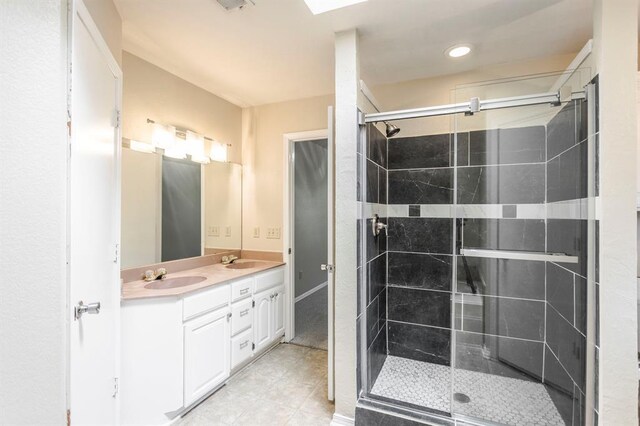 3305 Outpost Cir, Norman, OK 73072 - bathroom featuring a shower stall, double vanity, recessed lighting, and tile patterned flooring