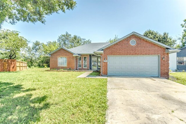 3305 Outpost Cir, Norman, OK 73072 - ranch-style house featuring driveway, a garage, and brick siding