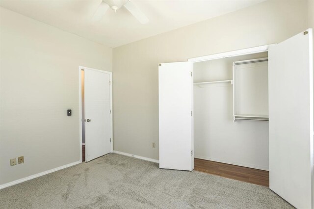 3305 Outpost Cir, Norman, OK 73072 - unfurnished bedroom with carpet flooring, a closet, baseboards, and ceiling fan