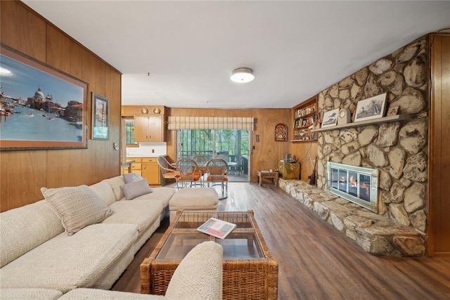 1392 Robin Hood Rd, Eufaula, OK 74432 - living area featuring wood walls, wood finished floors, and a stone fireplace