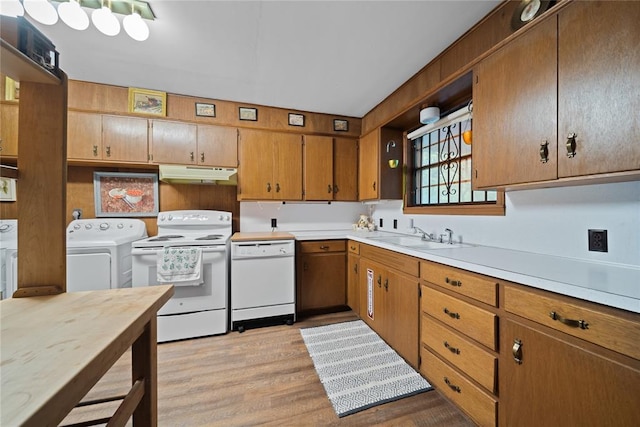 1392 Robin Hood Rd, Eufaula, OK 74432 - kitchen with white appliances, under cabinet range hood, a sink, washer and dryer, and light countertops