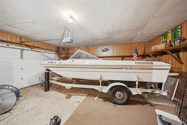 1392 Robin Hood Rd, Eufaula, OK 74432 - garage featuring wood walls and a garage door opener
