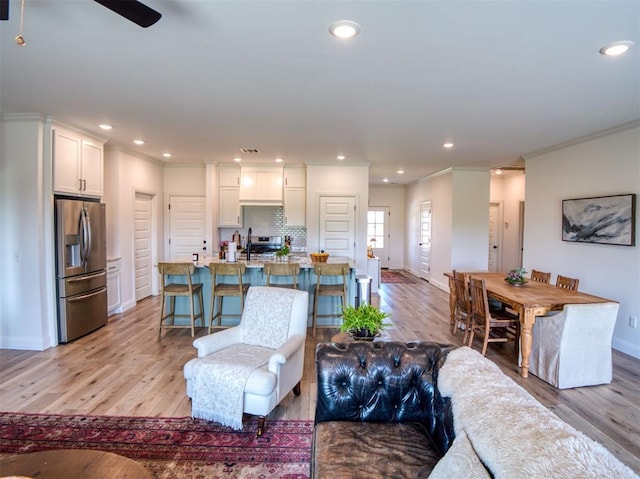 11611 Carefree Ln, Shawnee, OK 74804 - living room featuring baseboards, light wood-style floors, crown molding, and recessed lighting