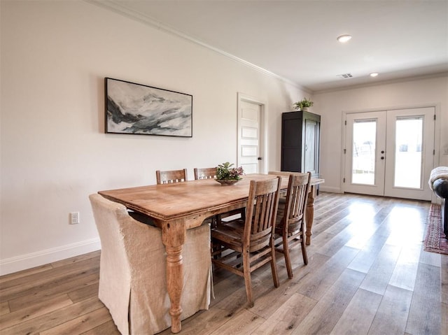 11611 Carefree Ln, Shawnee, OK 74804 - dining area with crown molding, light wood finished floors, baseboards, french doors, and recessed lighting
