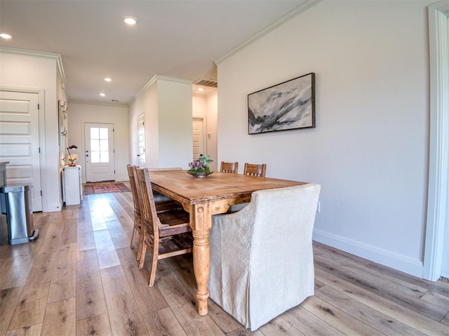 11611 Carefree Ln, Shawnee, OK 74804 - dining space with crown molding, light wood-style floors, baseboards, and recessed lighting