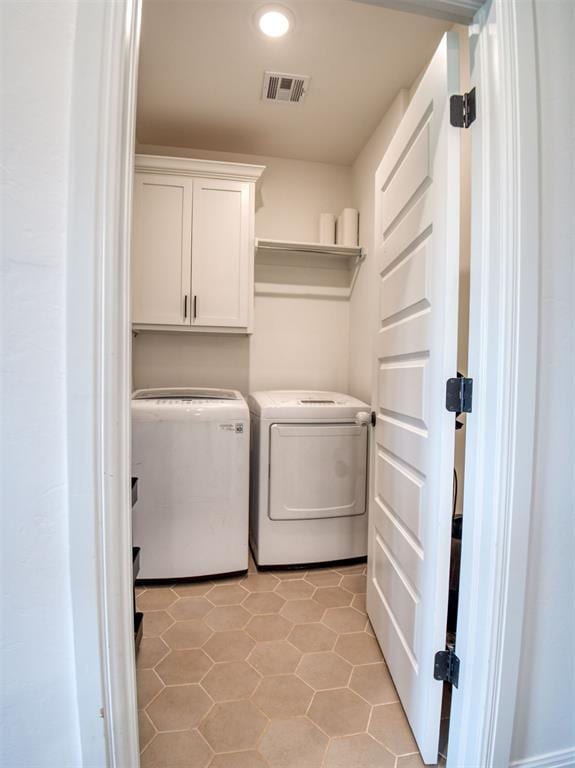 11611 Carefree Ln, Shawnee, OK 74804 - washroom with washer and dryer, cabinet space, light tile patterned floors, and recessed lighting