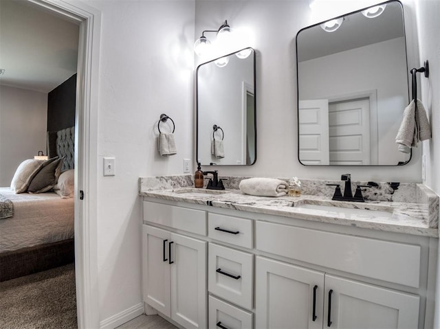 11611 Carefree Ln, Shawnee, OK 74804 - full bathroom featuring double vanity, ensuite bath, and baseboards