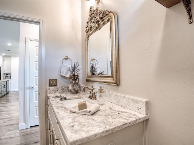 11611 Carefree Ln, Shawnee, OK 74804 - bathroom featuring wood finished floors and vanity