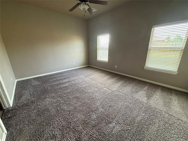 11232 NW 101st St, Yukon, OK 73099 - carpeted empty room with ceiling fan and baseboards