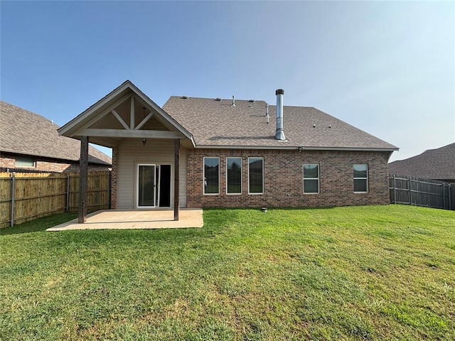 11232 NW 101st St, Yukon, OK 73099 - back of house featuring a patio area, brick siding, and roof with shingles