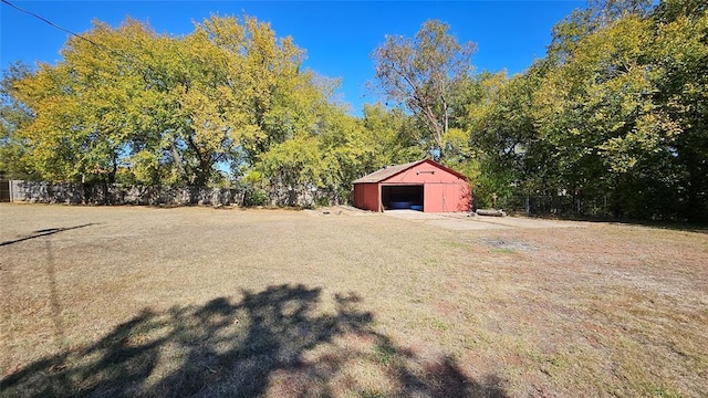 4001 N Bryan Ave, Shawnee, OK 74804 - view of yard featuring a detached garage and an outbuilding