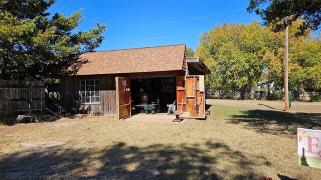 4001 N Bryan Ave, Shawnee, OK 74804 - exterior space with a shingled roof and an outdoor structure