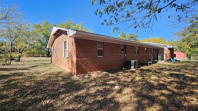 4001 N Bryan Ave, Shawnee, OK 74804 - view of property exterior featuring brick siding and central air condition unit