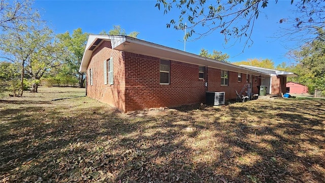 4001 N Bryan Ave, Shawnee, OK 74804 - rear view of property with brick siding and central AC unit