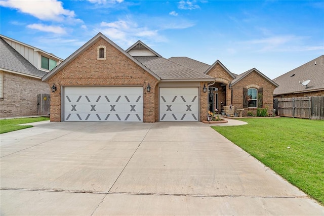 4813 Hidalgo Ave, Mustang, OK 73064 - view of front of house featuring brick siding, a garage, driveway, and roof with shingles