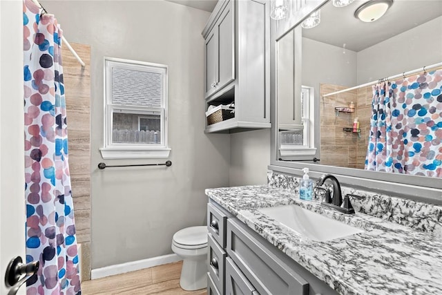4813 Hidalgo Ave, Mustang, OK 73064 - full bathroom featuring vanity, toilet, a shower with shower curtain, wood finished floors, and baseboards