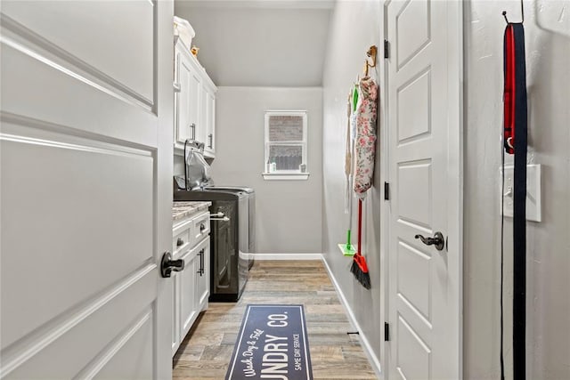 4813 Hidalgo Ave, Mustang, OK 73064 - laundry room with washer and clothes dryer, light wood-style floors, cabinet space, and baseboards