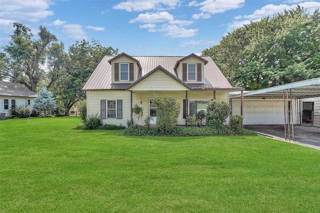 409 S Mcdonald St, Dill City, OK 73641 - cape cod-style house featuring a front lawn, an attached garage, driveway, a carport, and metal roof