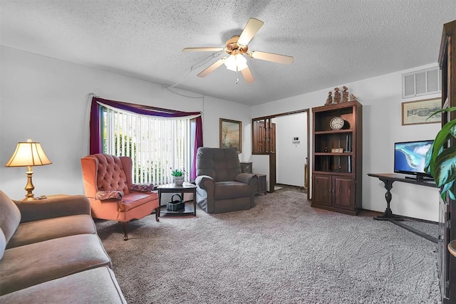 409 S Mcdonald St, Dill City, OK 73641 - living area featuring carpet floors, a textured ceiling, and ceiling fan