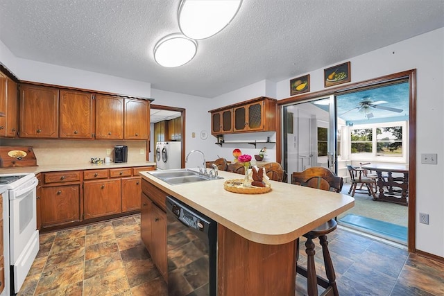 409 S Mcdonald St, Dill City, OK 73641 - kitchen featuring black dishwasher, white electric stove, a sink, stone finish flooring, and a textured ceiling
