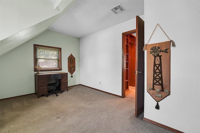 409 S Mcdonald St, Dill City, OK 73641 - office space with carpet, baseboards, vaulted ceiling, and a textured ceiling