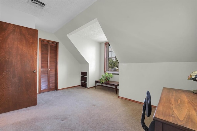 409 S Mcdonald St, Dill City, OK 73641 - carpeted office space featuring vaulted ceiling, a textured ceiling, and baseboards