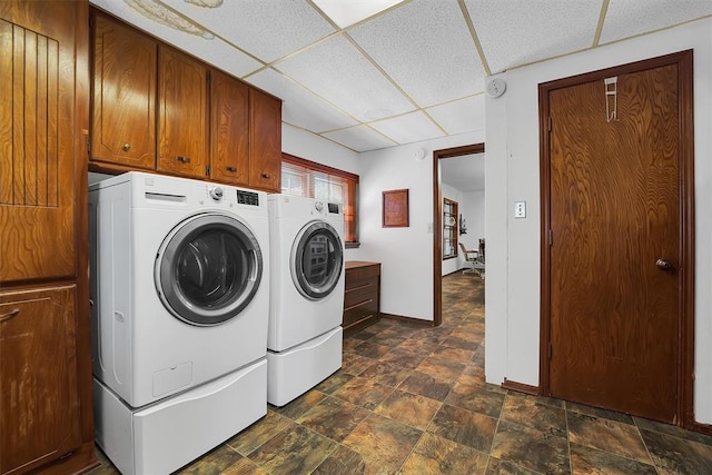 409 S Mcdonald St, Dill City, OK 73641 - laundry area with cabinet space, separate washer and dryer, baseboards, and dark stone finish flooring