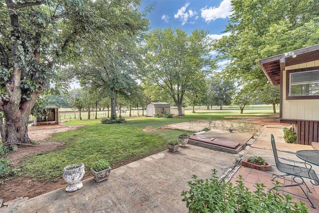 409 S Mcdonald St, Dill City, OK 73641 - view of green lawn featuring a patio area