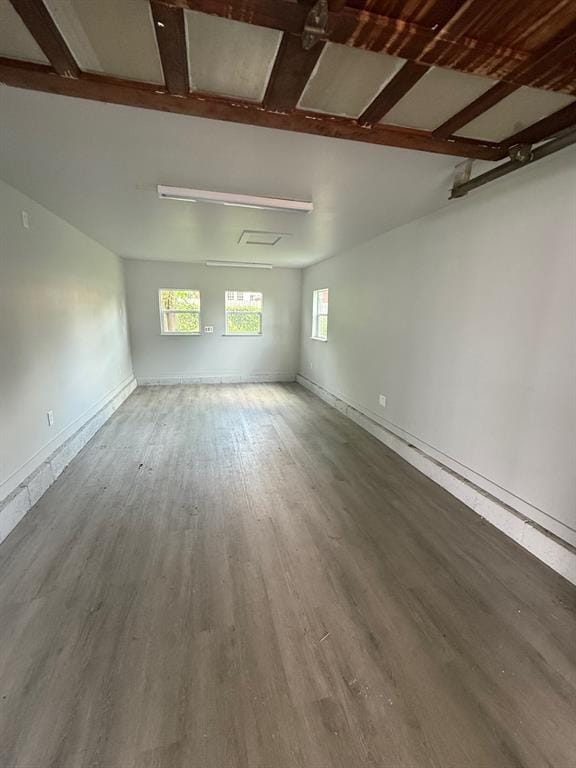 1707 N Louisa Ave, Shawnee, OK 74804 - empty room featuring wood finished floors and baseboards