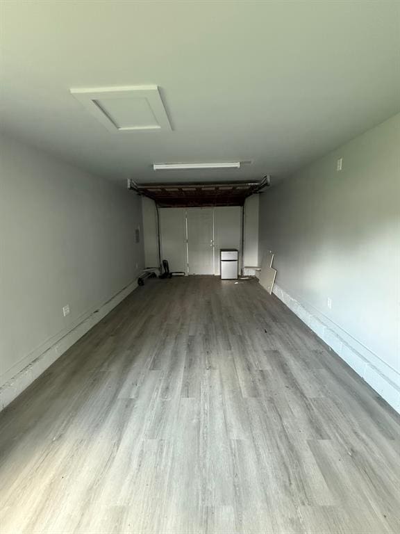 1707 N Louisa Ave, Shawnee, OK 74804 - garage featuring baseboards
