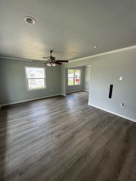 1707 N Louisa Ave, Shawnee, OK 74804 - empty room featuring baseboards, crown molding, a ceiling fan, dark wood finished floors, and recessed lighting