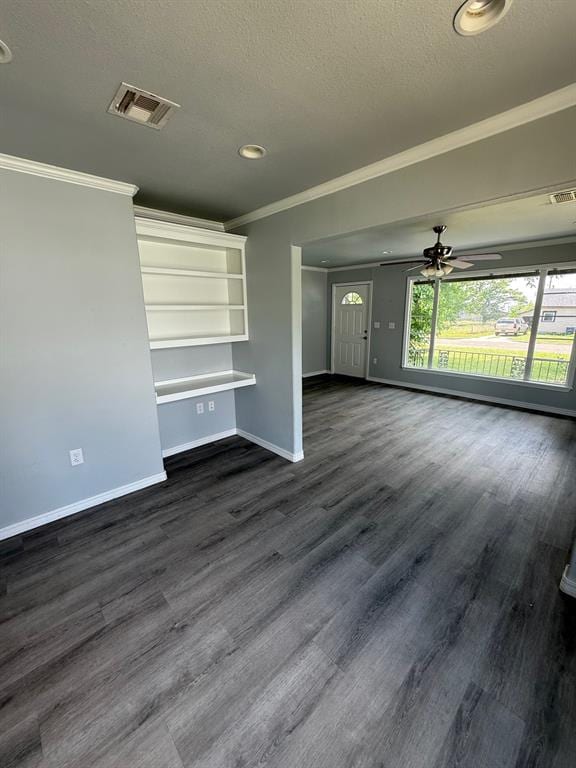 1707 N Louisa Ave, Shawnee, OK 74804 - unfurnished living room featuring ornamental molding, baseboards, dark wood-style floors, a ceiling fan, and a textured ceiling