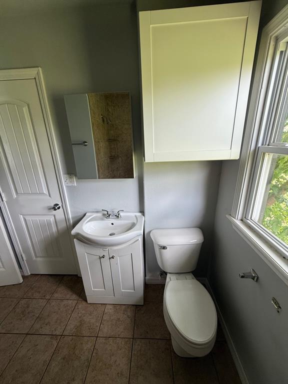 1707 N Louisa Ave, Shawnee, OK 74804 - bathroom with vanity, toilet, and tile patterned floors