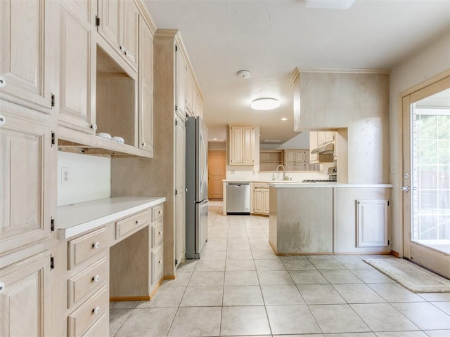 1312 Every Dr, Edmond, OK 73034 - kitchen featuring appliances with stainless steel finishes, under cabinet range hood, a sink, and plenty of natural light